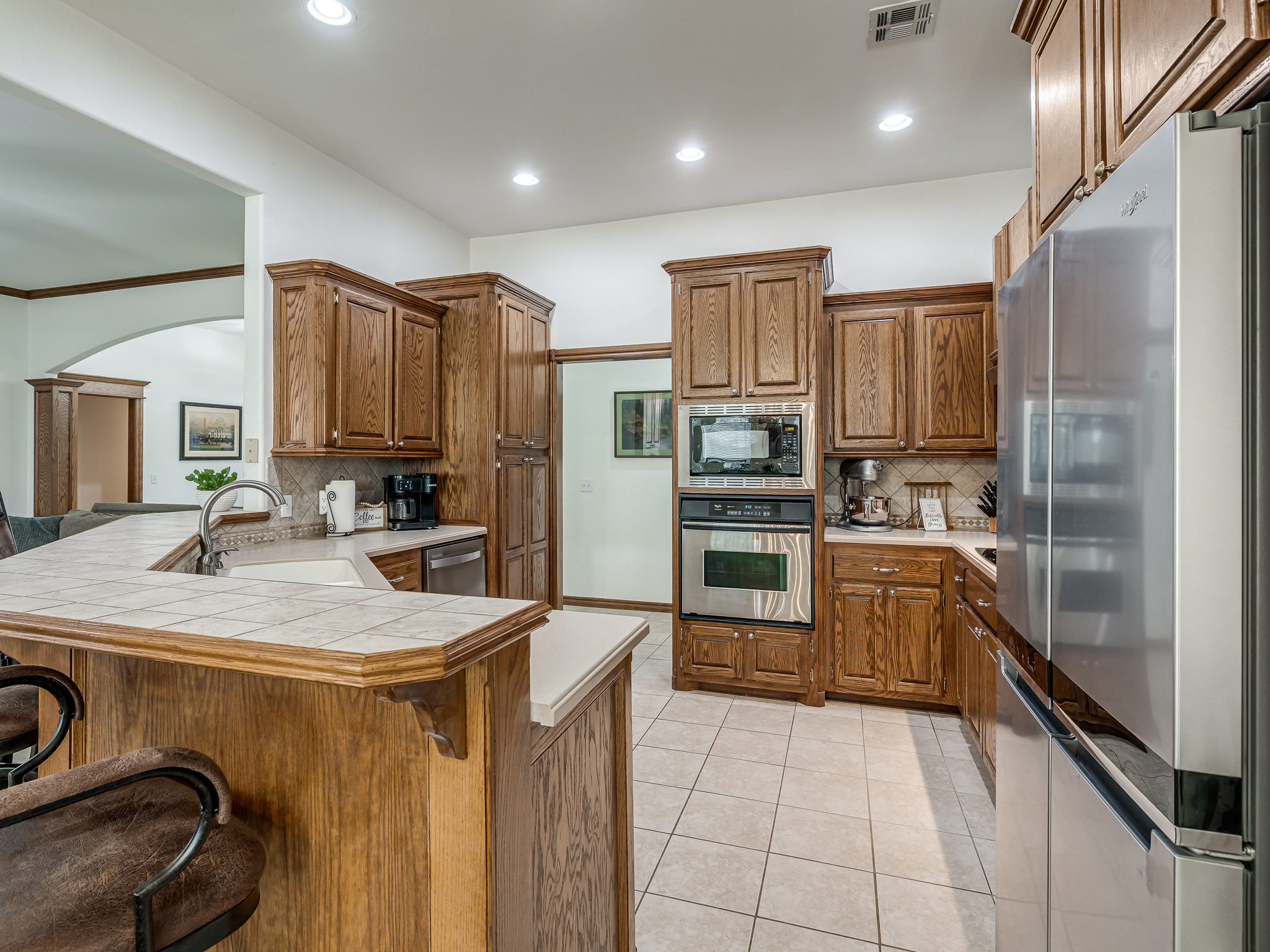 Stainless Appliances, Tile Flooring and Corian Counter Tops