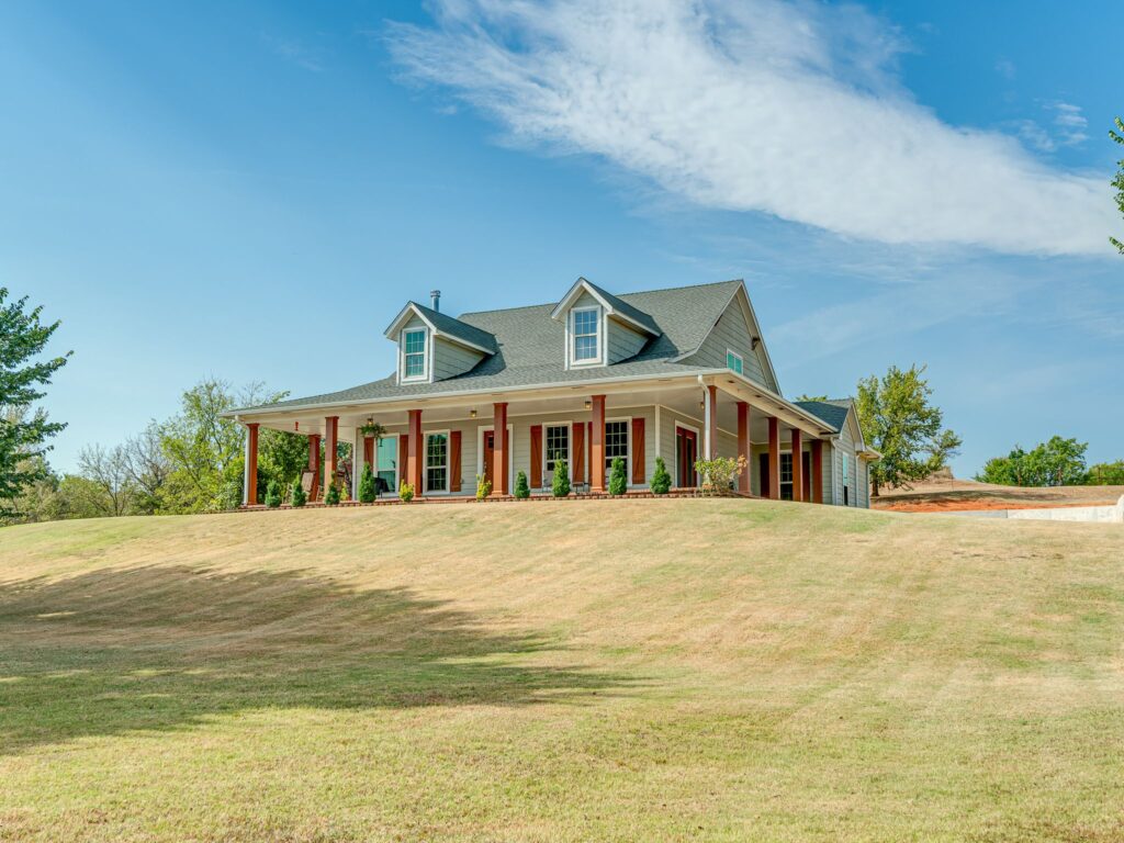 Custom Built, One Owner Home with Cover Walk-Around Porch on 3 Sides of Home and Entry Doors on Each Side.  The Whole Acreage is Visible from the Homestead!  