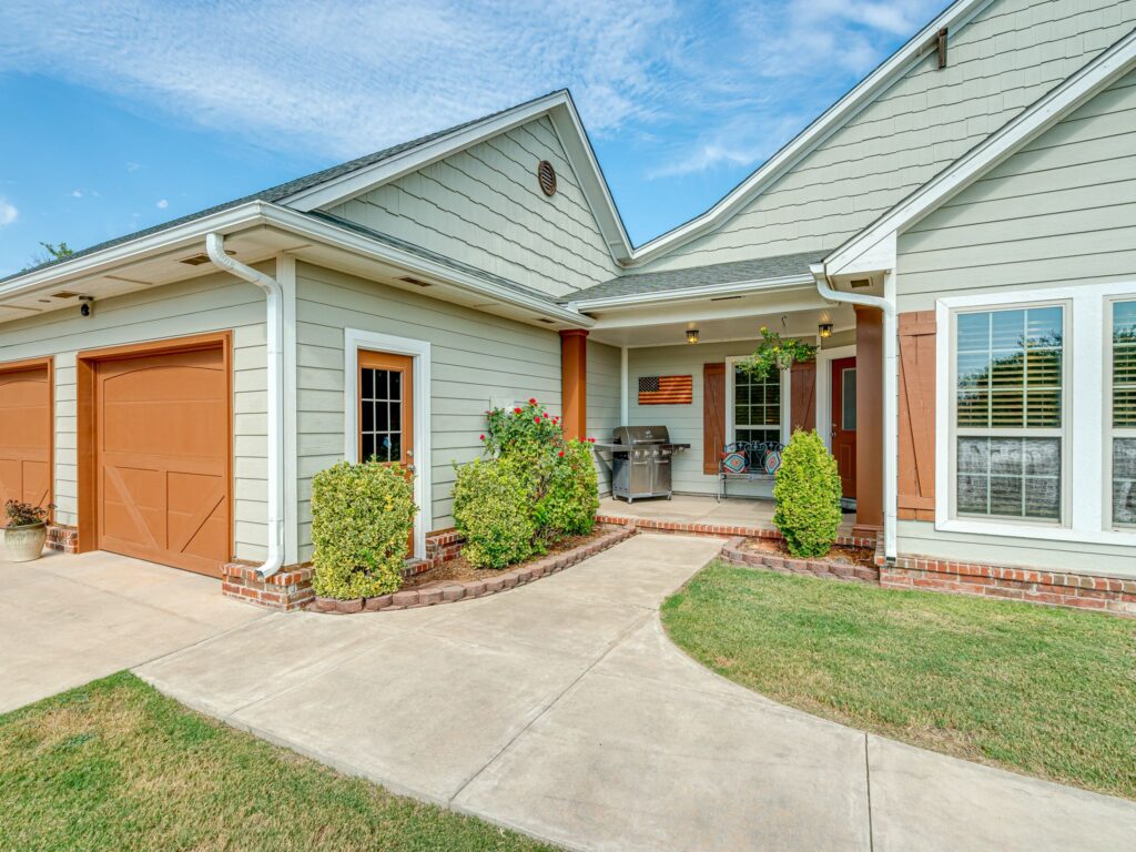 Concrete Sidewalk leads Visitors around to the Front Door on the North   Side of the Walk-Around Porch