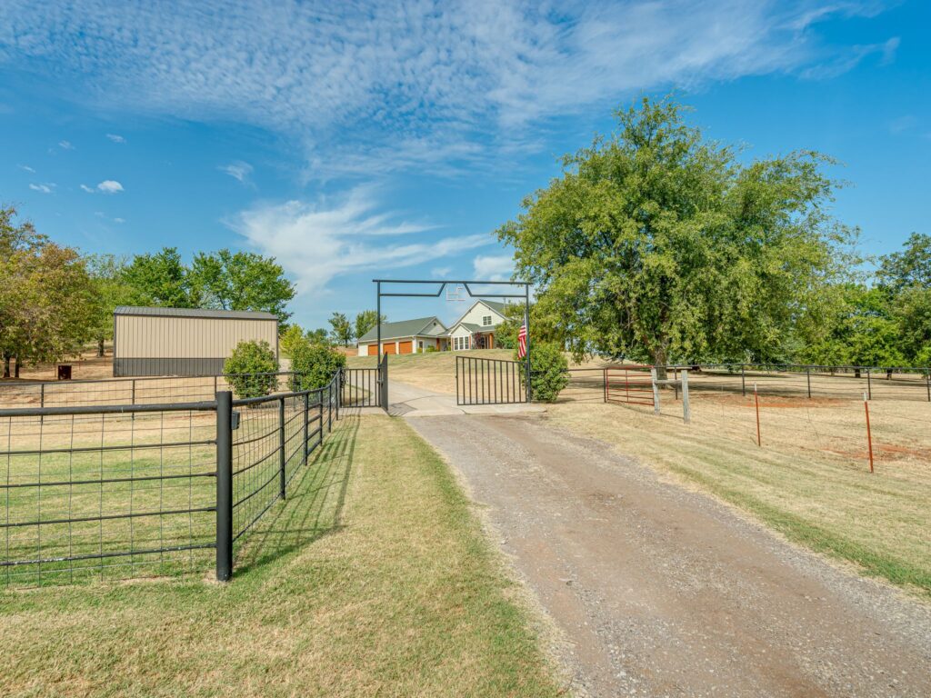 Gravel Drive and Electric Gate Up to Shop, then Concrete Drive Up to the 3 Car Garage