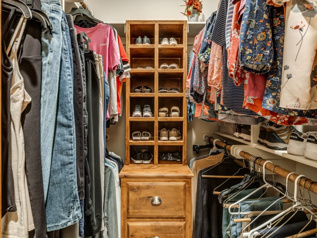 Primary Bedroom "Her" Walk In Closets with Built-Ins
