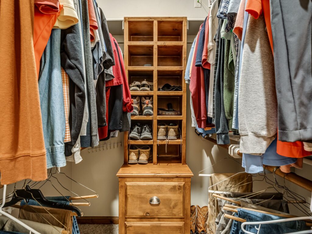 Primary Bedroom "His"  Walk In Closets with Built-Ins