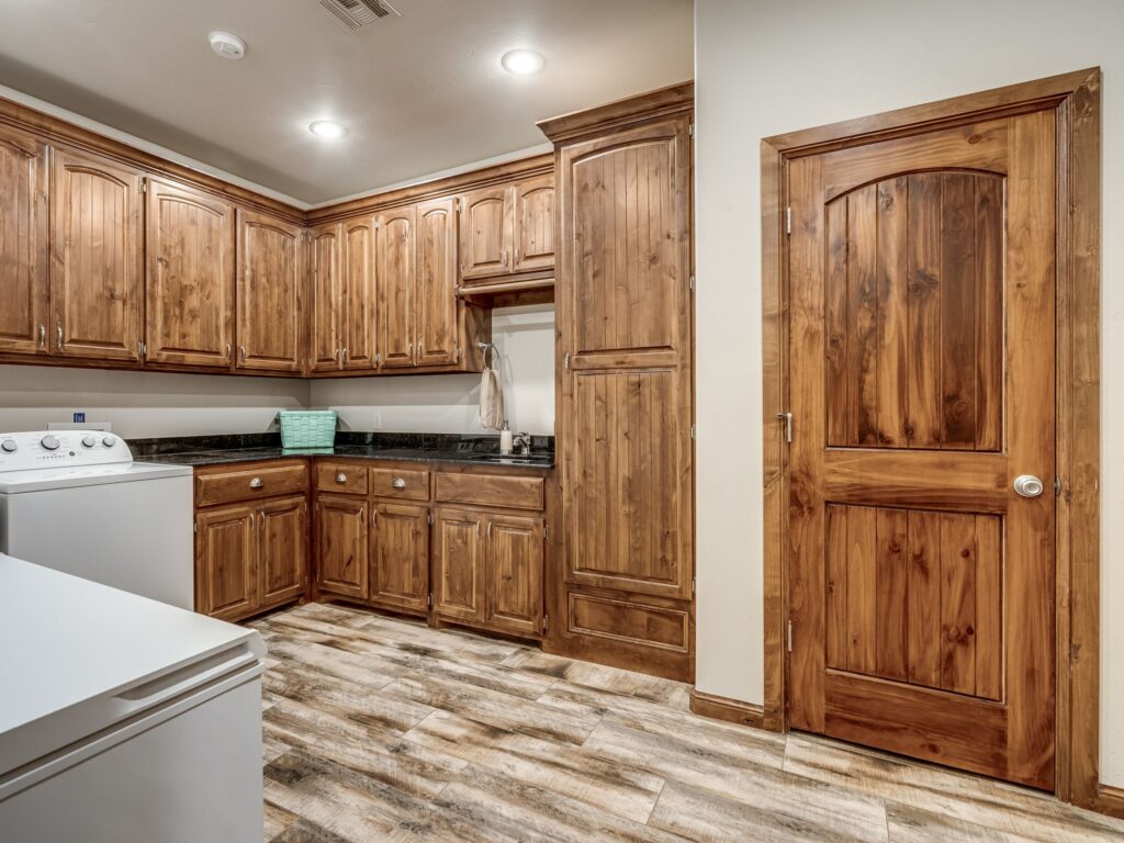 Oversized Utility Room, with Sink, Folder Counter, Storage Cabinets & Closet... with Room for Upright or Chest Freezers